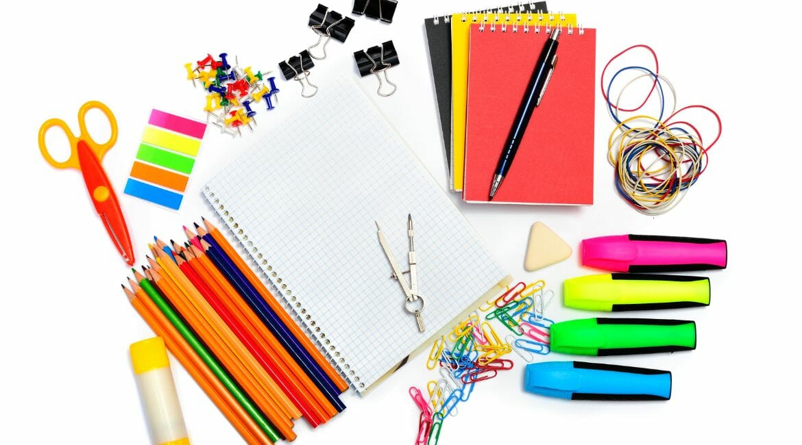 School Supplies Arranged On A White Background For Homeschooling.